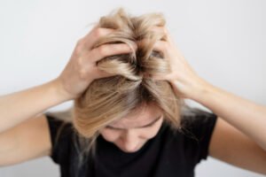 Women suffering from itchy scalp